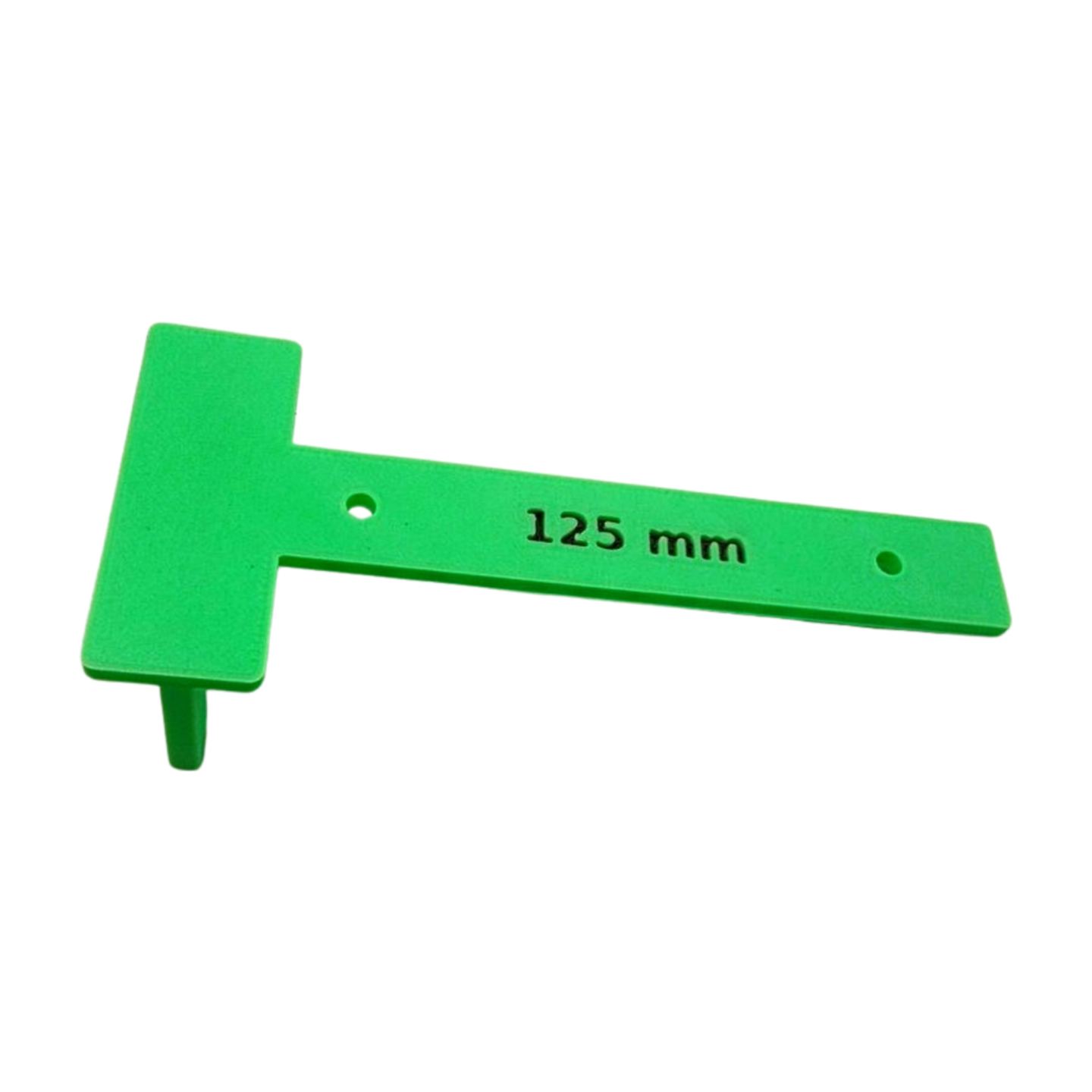 Close-up of drill jig showing precise hole alignment and five millimeter spacing tab