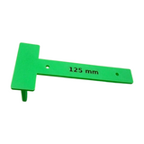 Close-up of drill jig showing precise hole alignment and five millimeter spacing tab