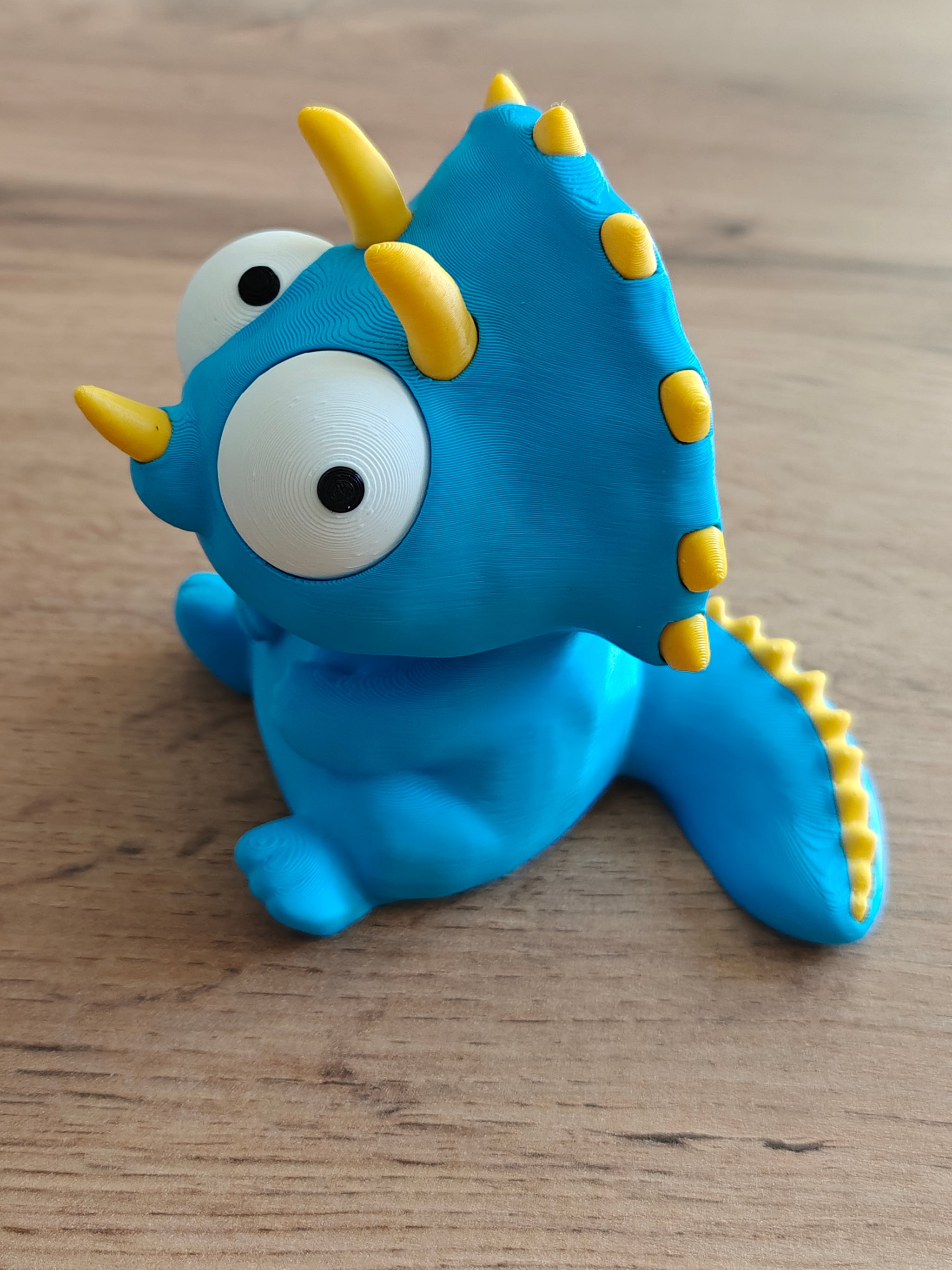 Detail shot of the rotating googly eyes on the Goofy Triceratops figure