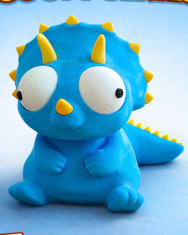 Goofy triceratops figure with movable googly eyes, close-up on white background
