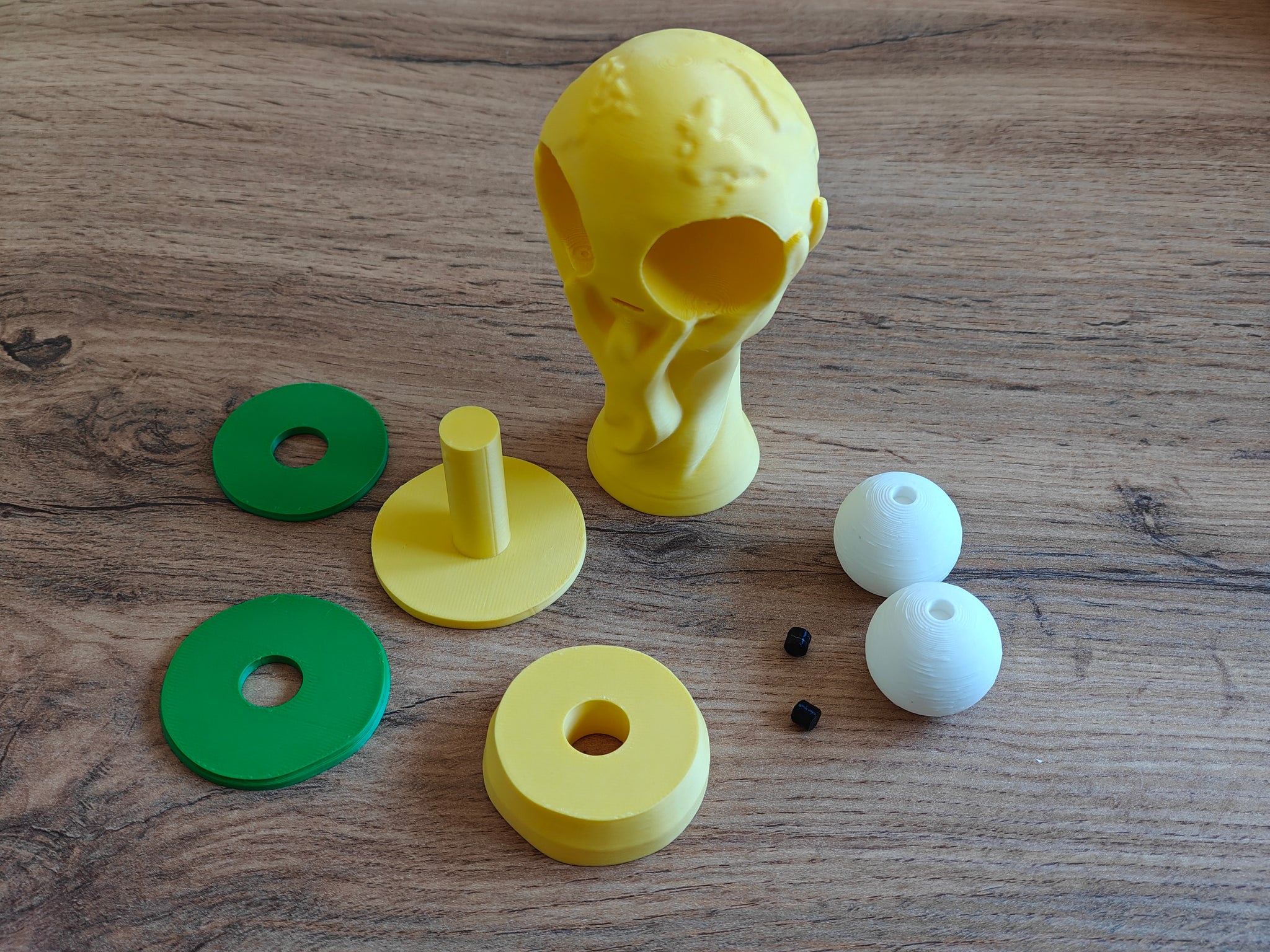 Goofy world cup trophy figure styled on a desk next to a keyboard and small decor items