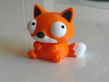 Close-up of Foxie's rotating googly eyes showing different funny expressions
