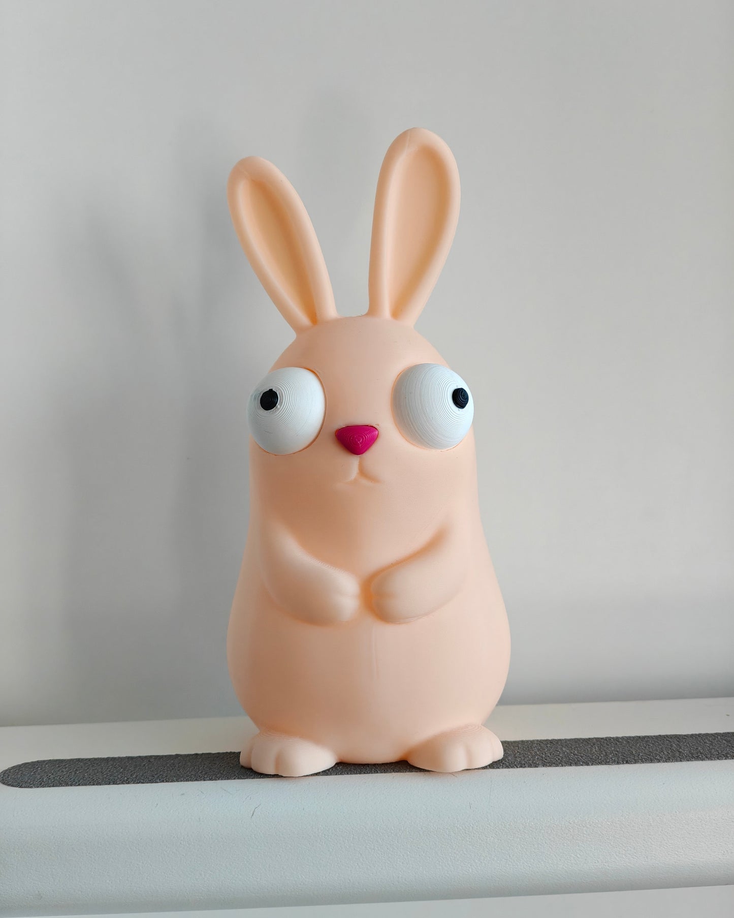Close-up of the movable googly eyes on the goofy Easter bunny figure