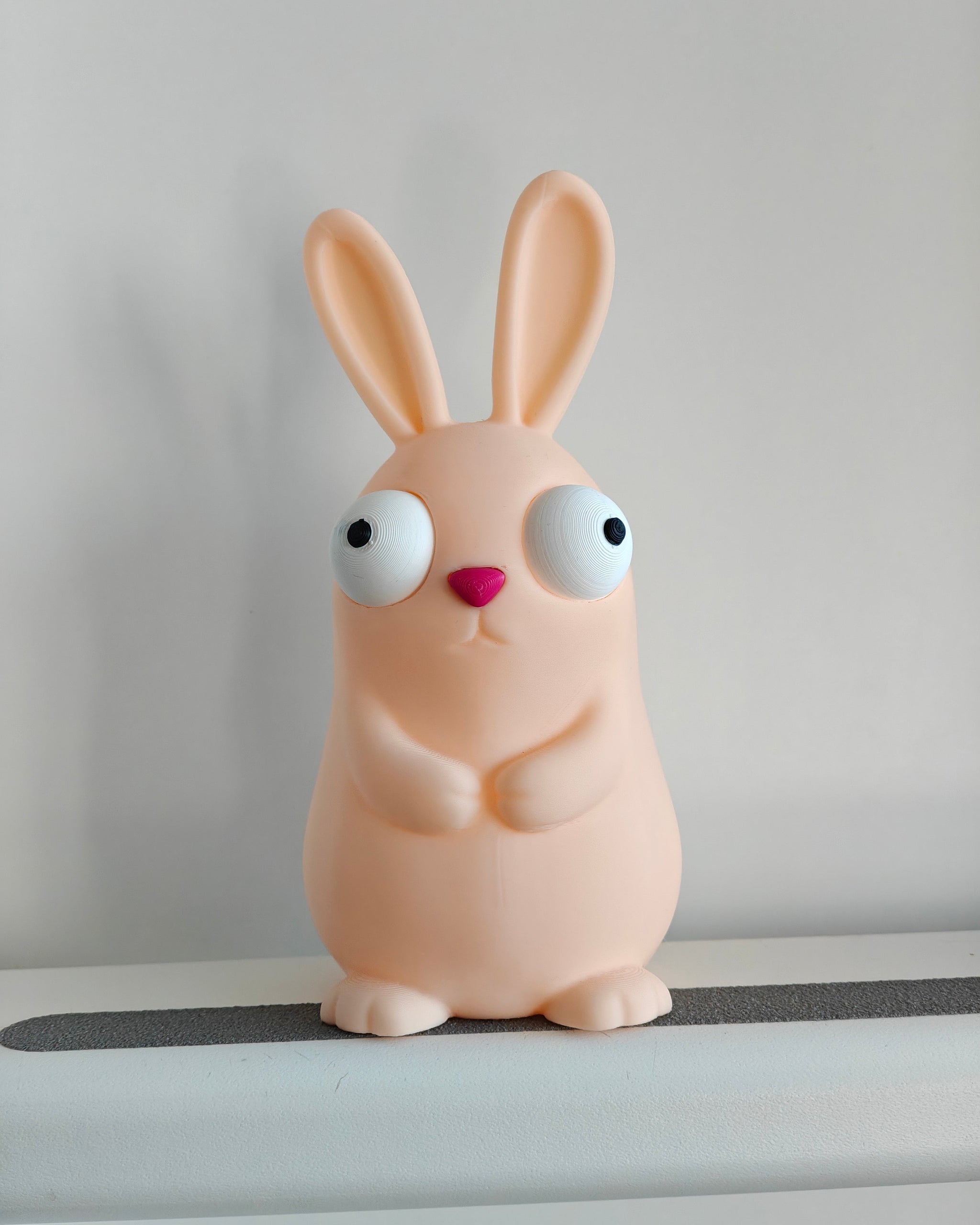 Close-up of the movable googly eyes on the goofy Easter bunny figure