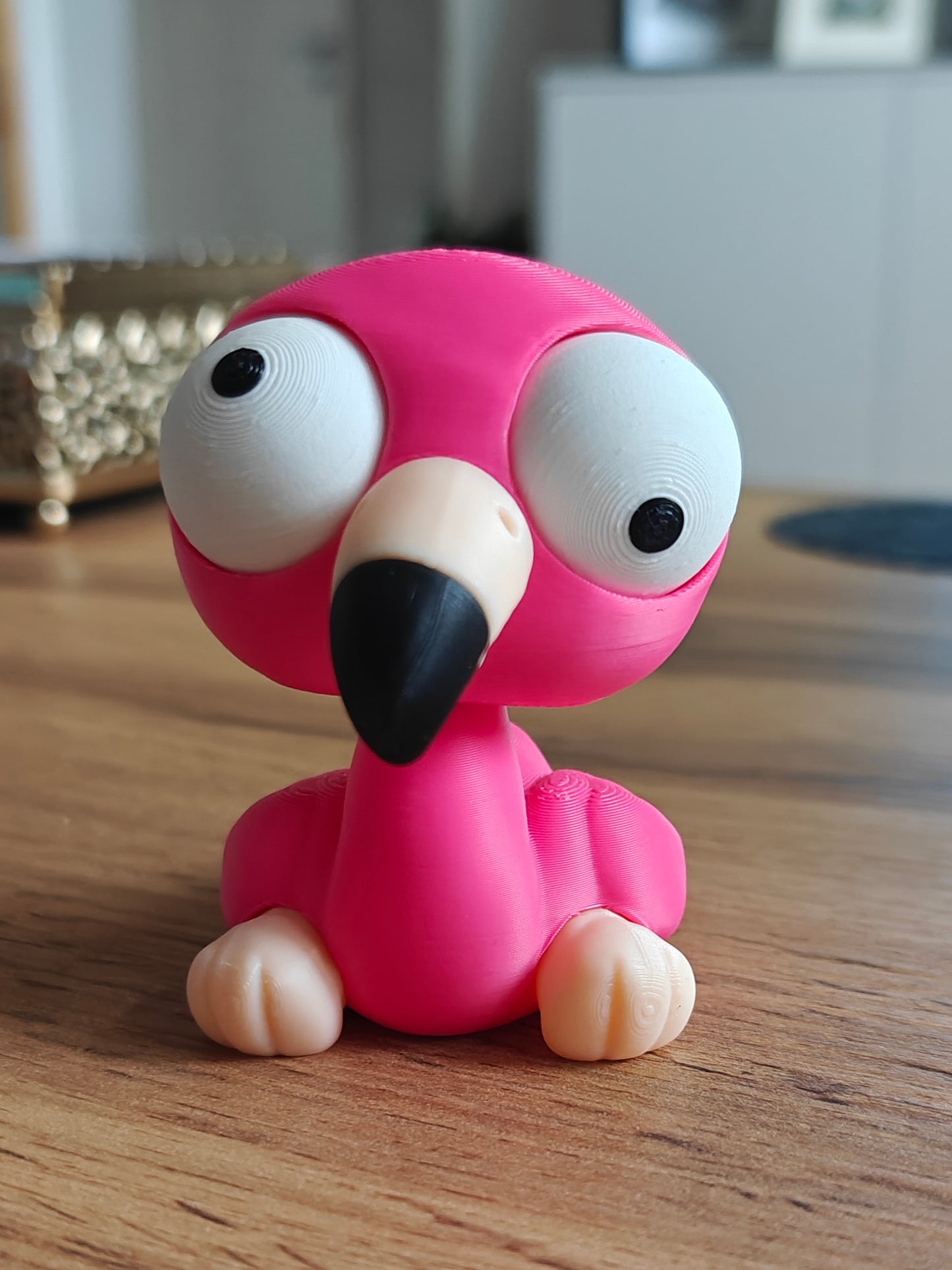 Close-up of flamingo figure with large movable googly eyes, Goofy Series character