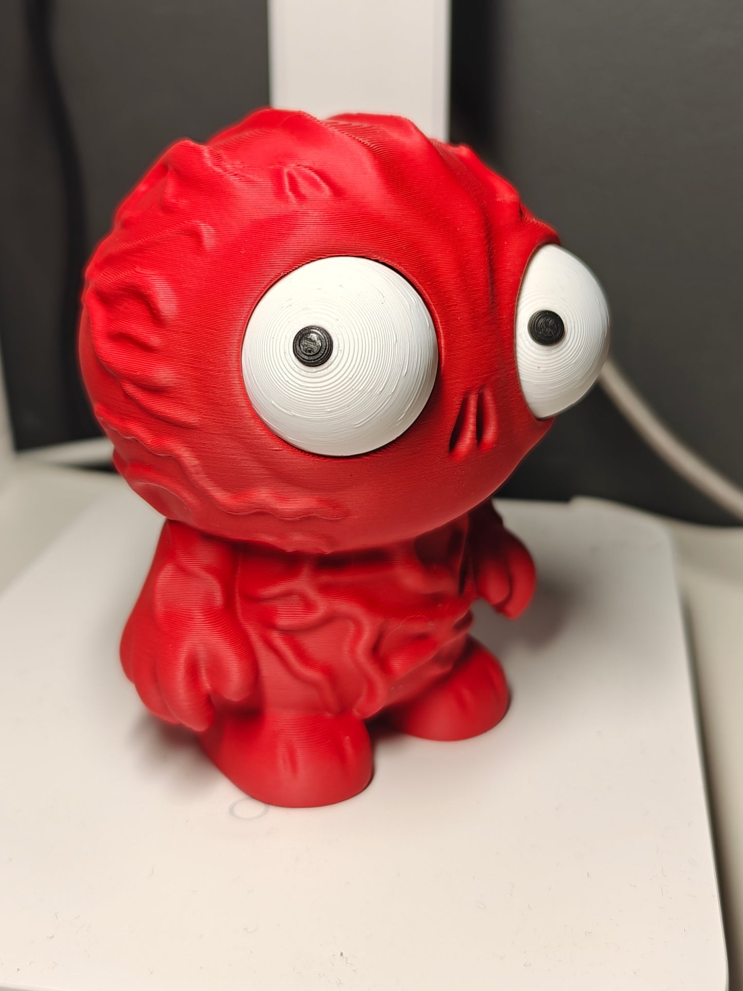 Detail shot of the movable googly eyes on the Vecna chibi figure, showing different silly expressions