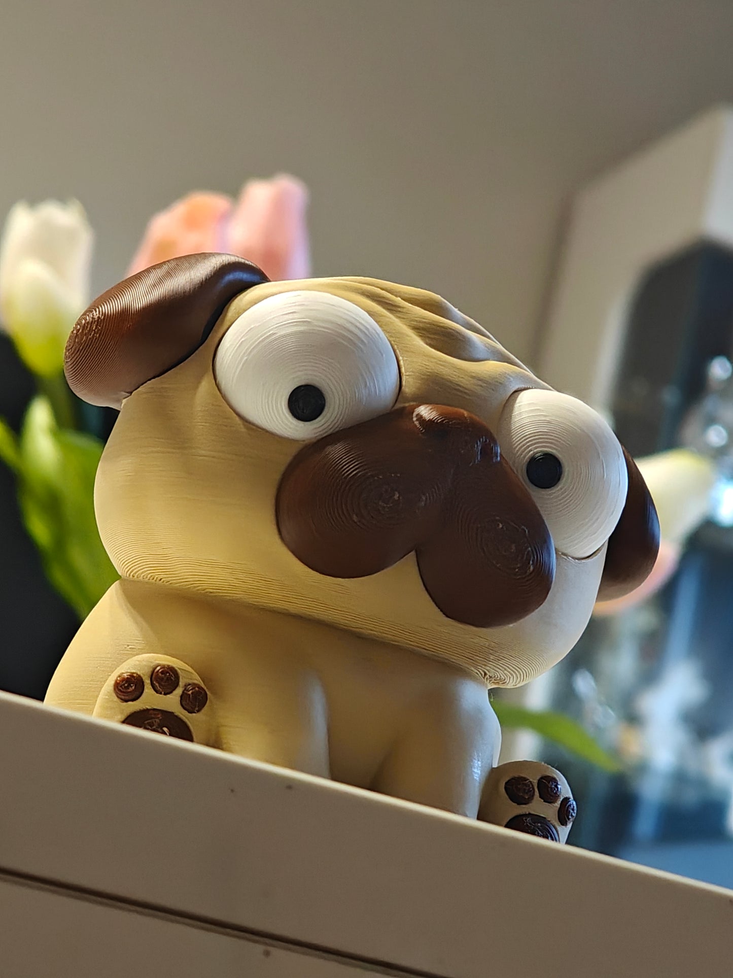 Pug figure with movable googly eyes on white background — Puggy desk toy