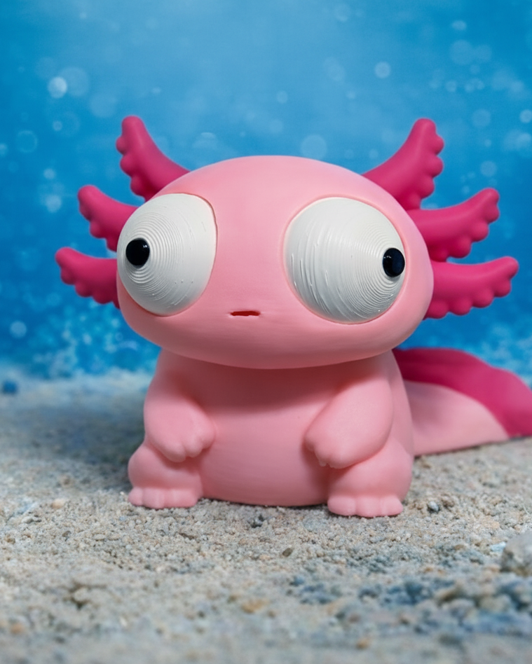 Goofy axolotl figure with large movable googly eyes, front view on white background