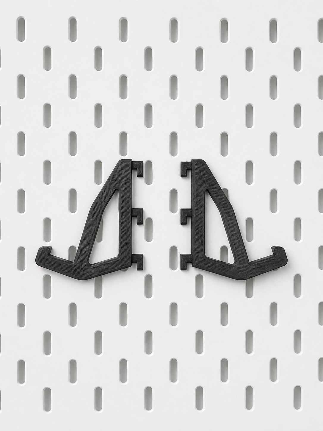 Close-up of three-prong attachment hook securely gripping mechanical keyboard frame