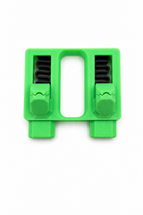 Close-up of dual spring-loaded clamp mechanism gripping aligned wires firmly