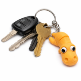 Four-centimeter dinosaur charm displayed showing its lightweight compact size and handcrafted finish