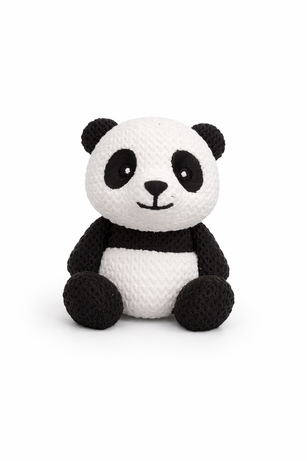 Side profile view of panda figure displayed on a wooden shelf