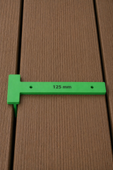 Three plastic decking drill jigs in different widths with engraved size measurements