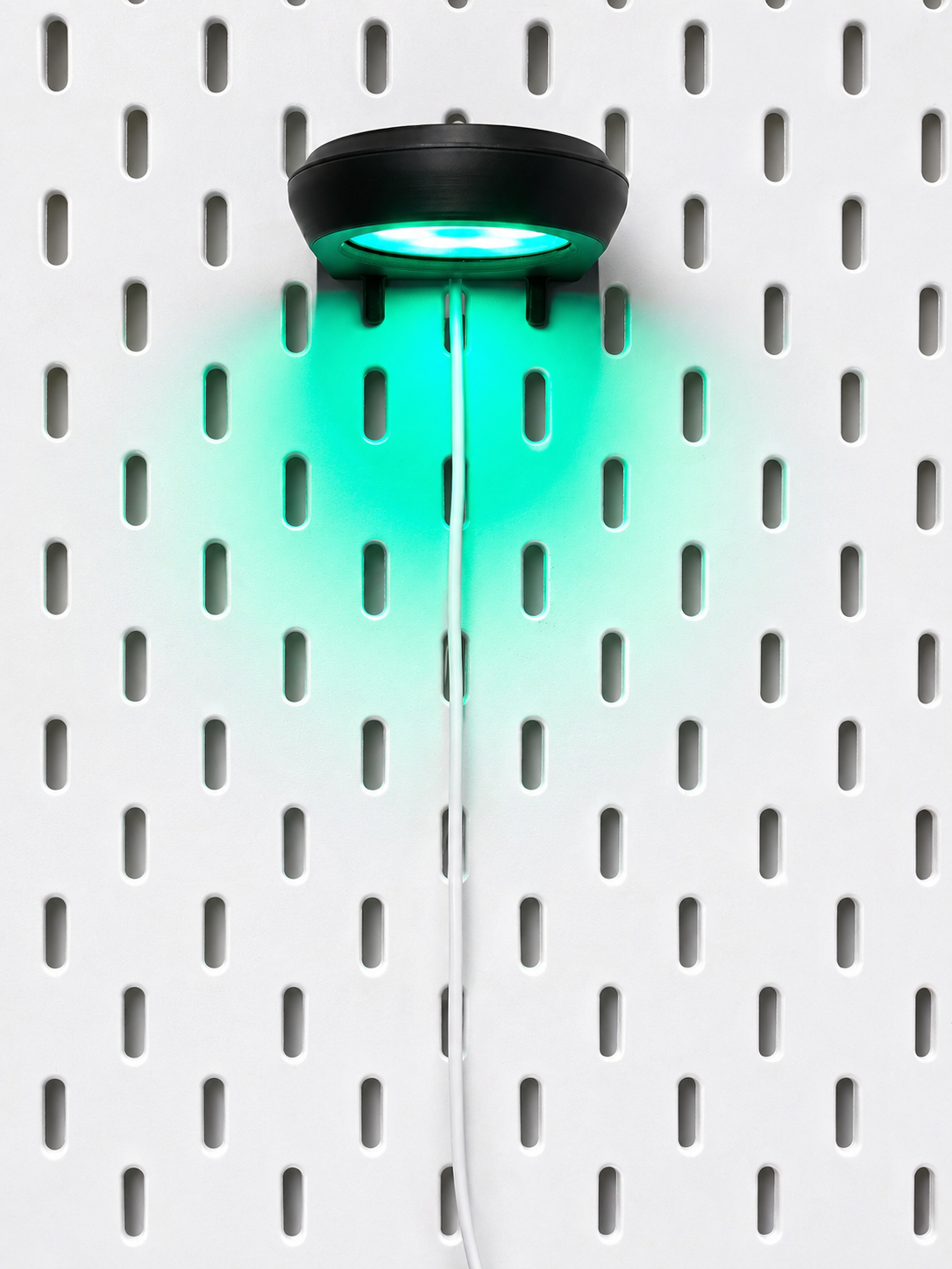Skadis pegboard accent light in use on gaming desk setup with color-changing effects