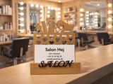 Close-up detail of 3D printed hairdresser-themed design and carved surface finish