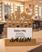 Elegant salon business card holder with decorative scissors and comb motifs
