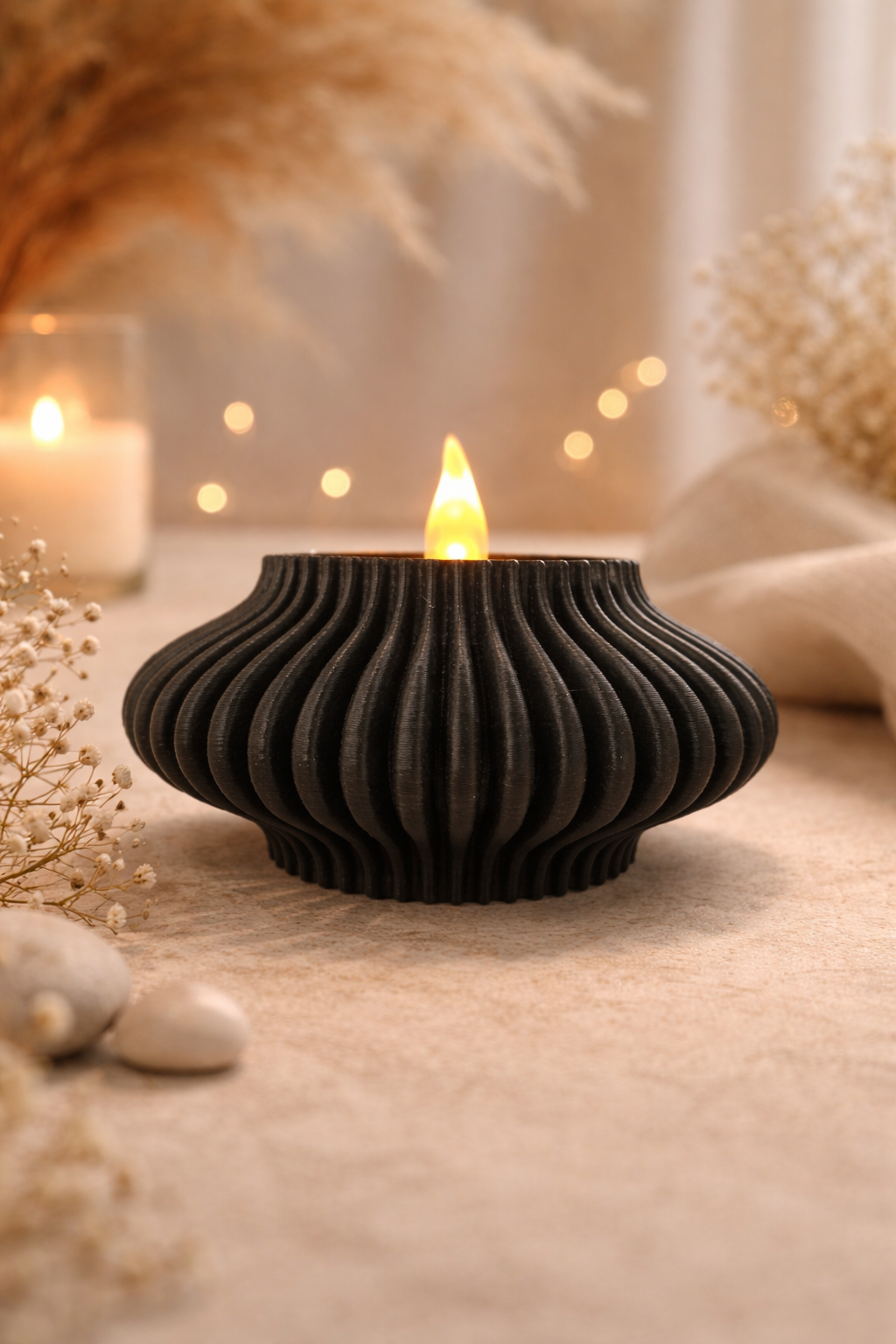Tea light holder positioned on table with warm LED light glowing through grooves