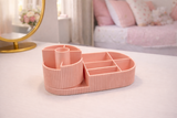Close-up detail of rotating left section and organized makeup brush storage compartments