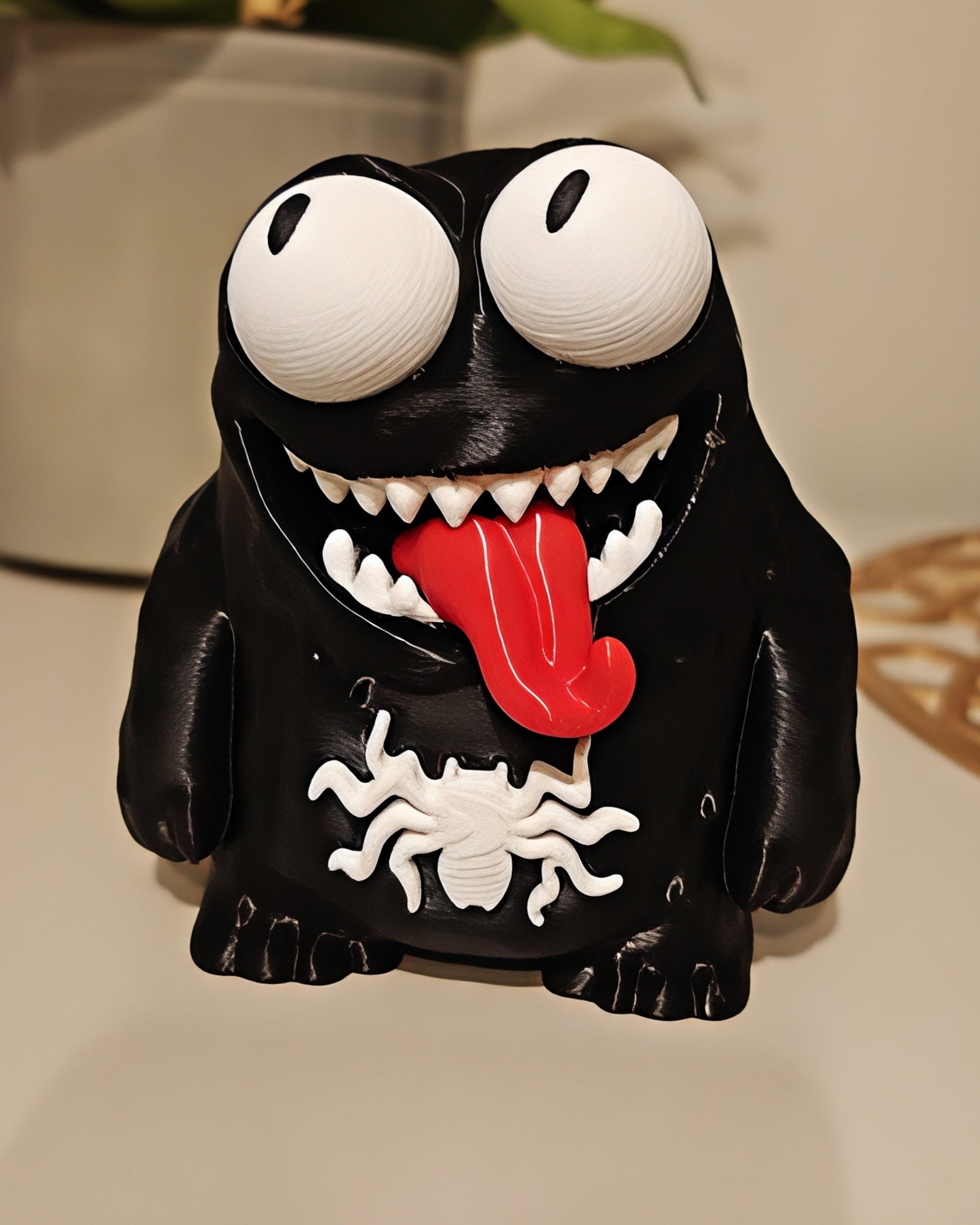 Close-up of Venom goofy figure with big movable googly eyes on a white background