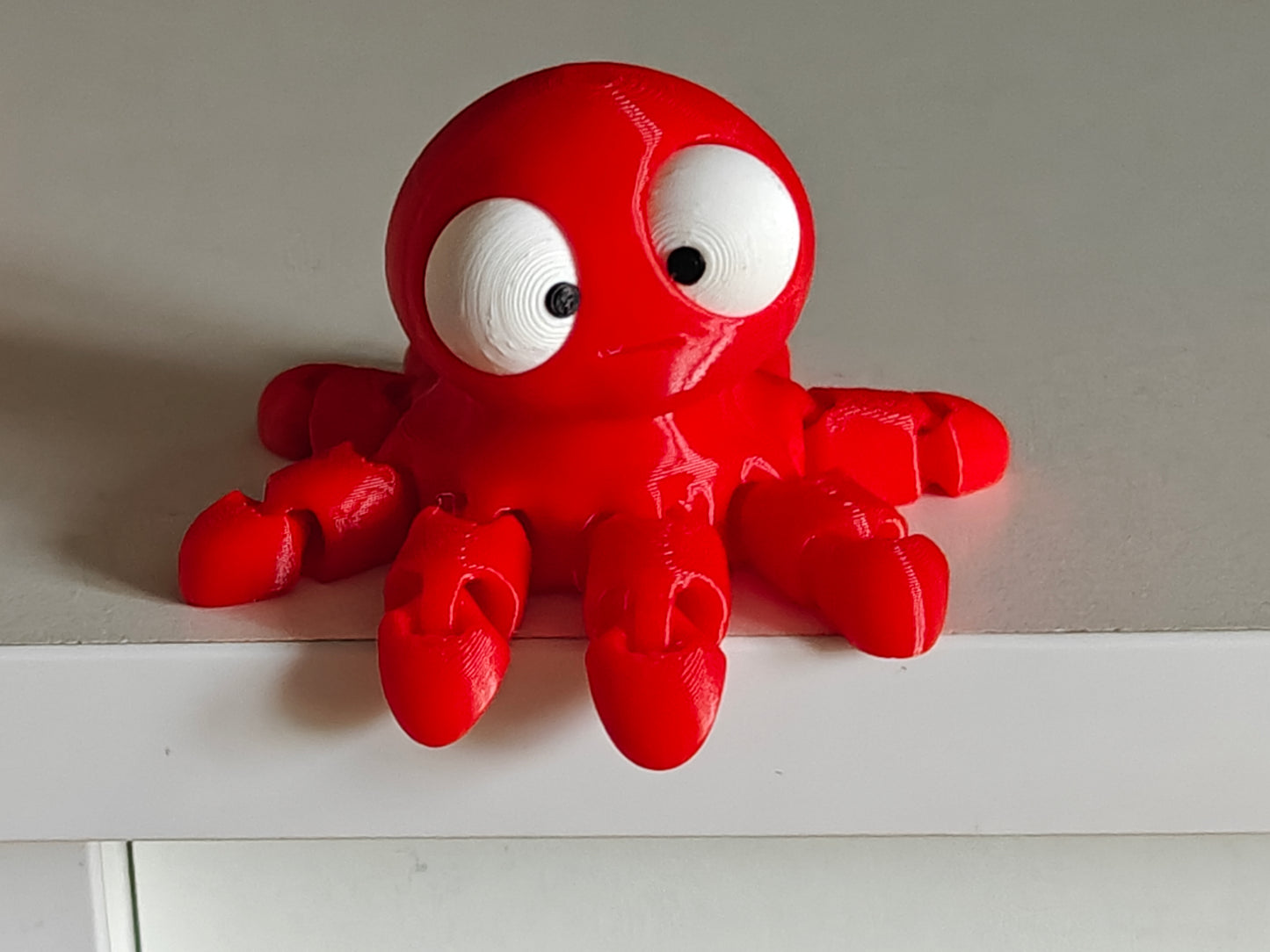 Detail of the articulated tentacles and oversized movable eyes on the mini flexi octopus