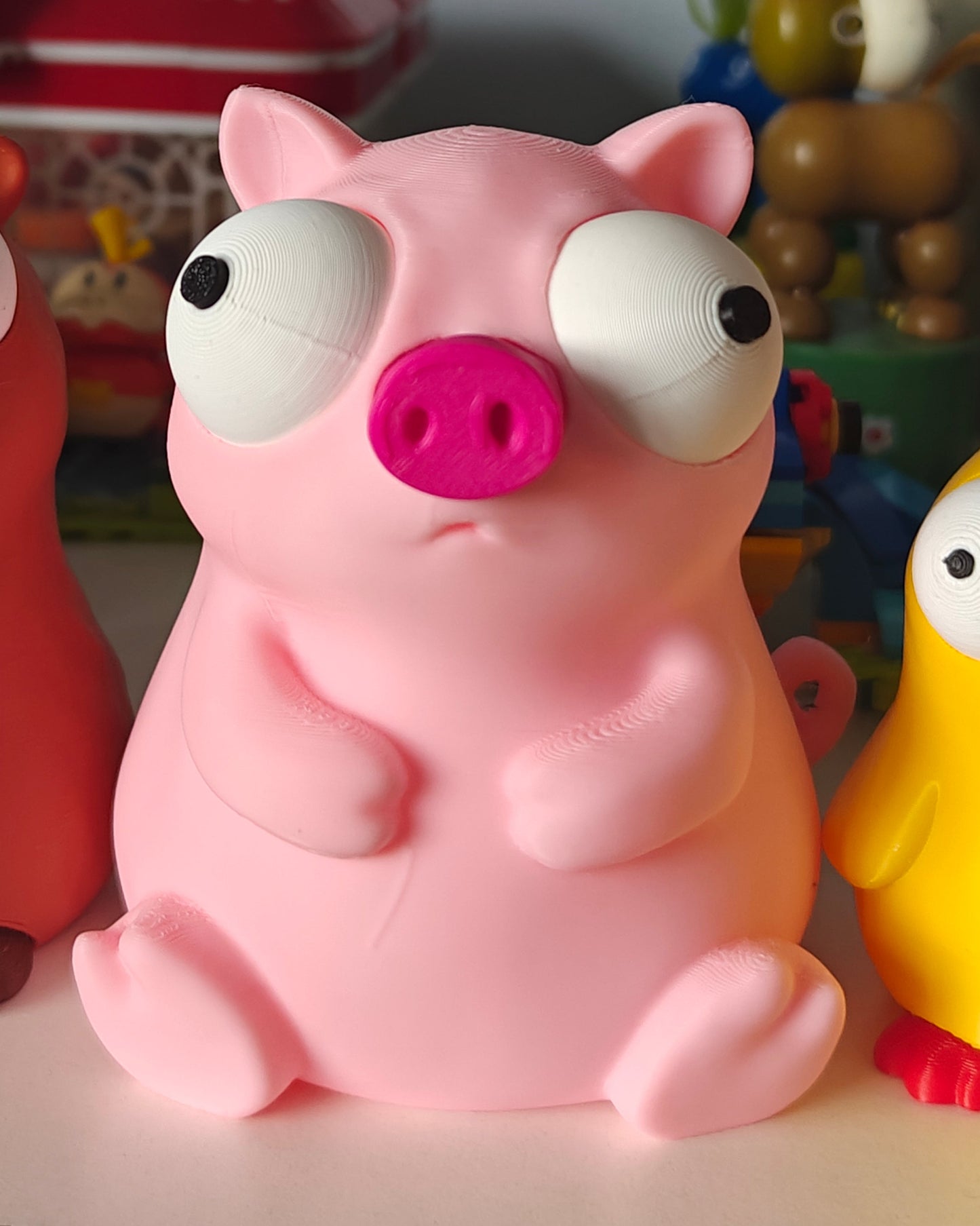 Close-up of Goofy Series pig figure with big movable googly eyes, front view