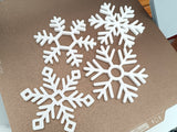 Set mit 4 Untersetzern in Schneeflockenform