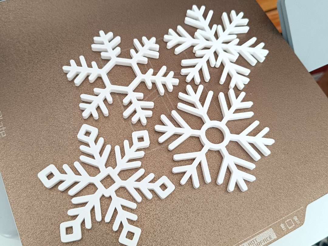 Set mit 4 Untersetzern in Schneeflockenform