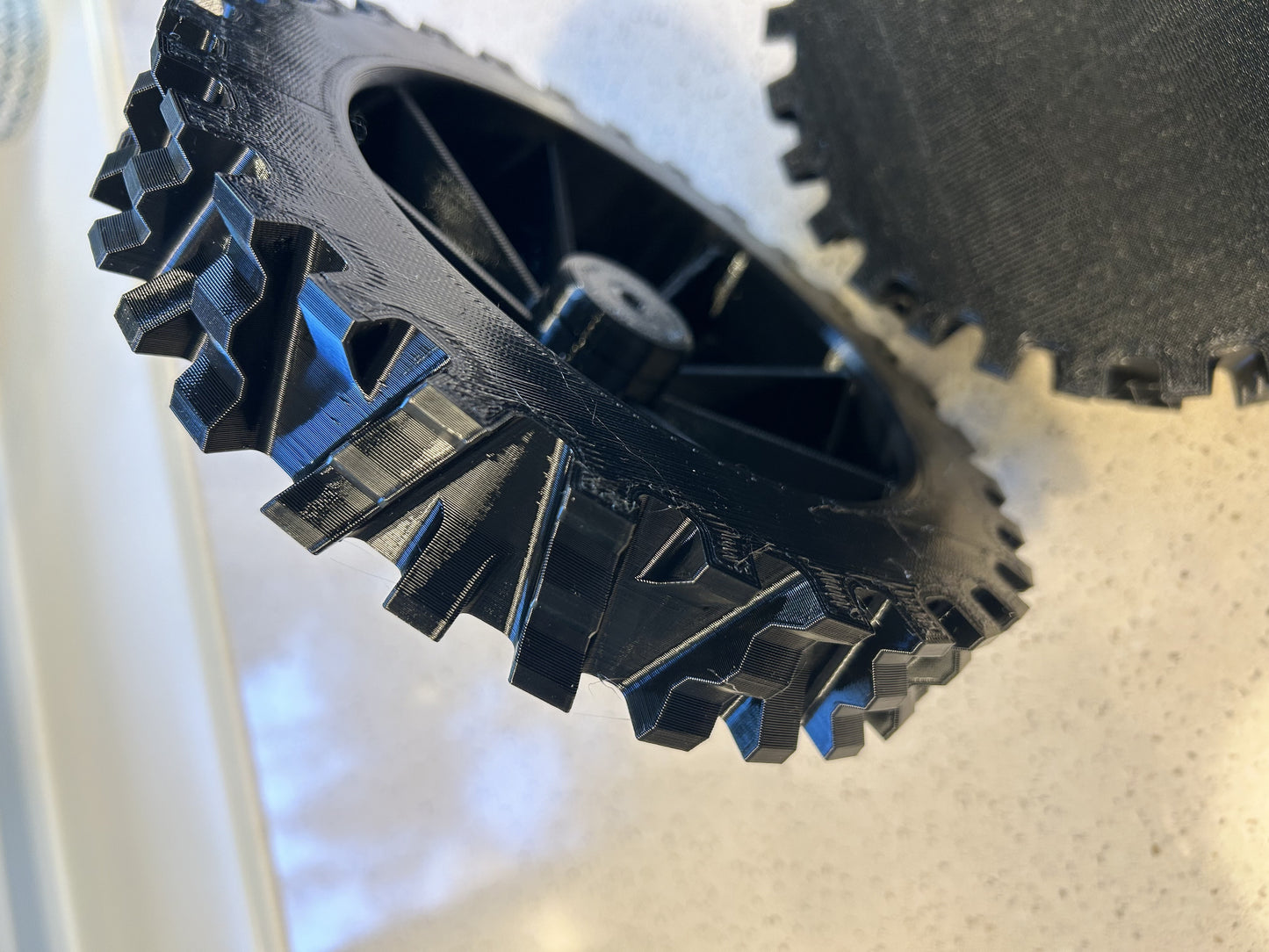 Stihl iMOW RMI terrain wheel — angle view
