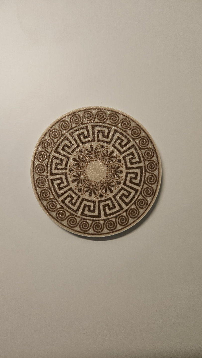 Close-up of Greek ornamental pattern on single coaster with multicolored geometric design