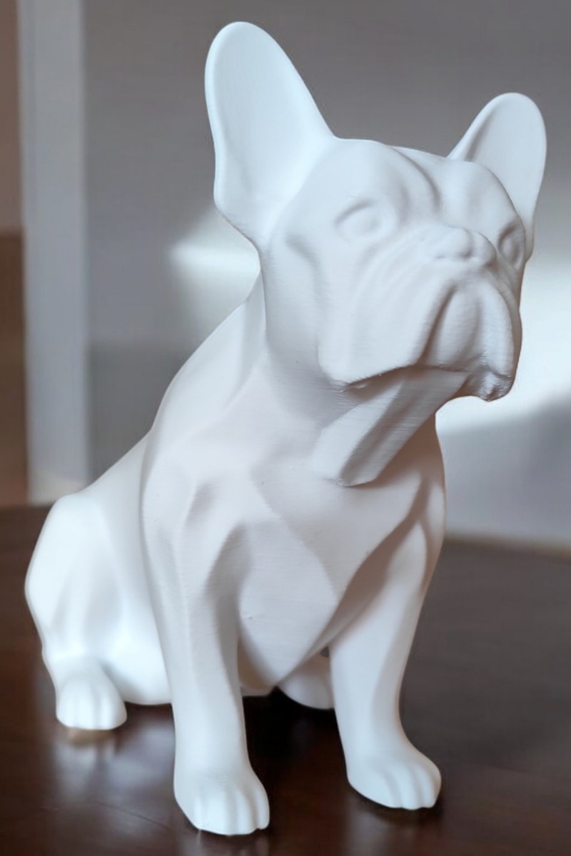 Minimalist french bulldog sculpture in profile, showing realistic proportions and clean lines