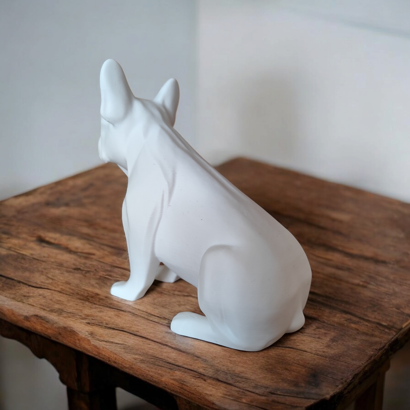 Minimalist french bulldog sculpture in profile, showing realistic proportions and clean lines
