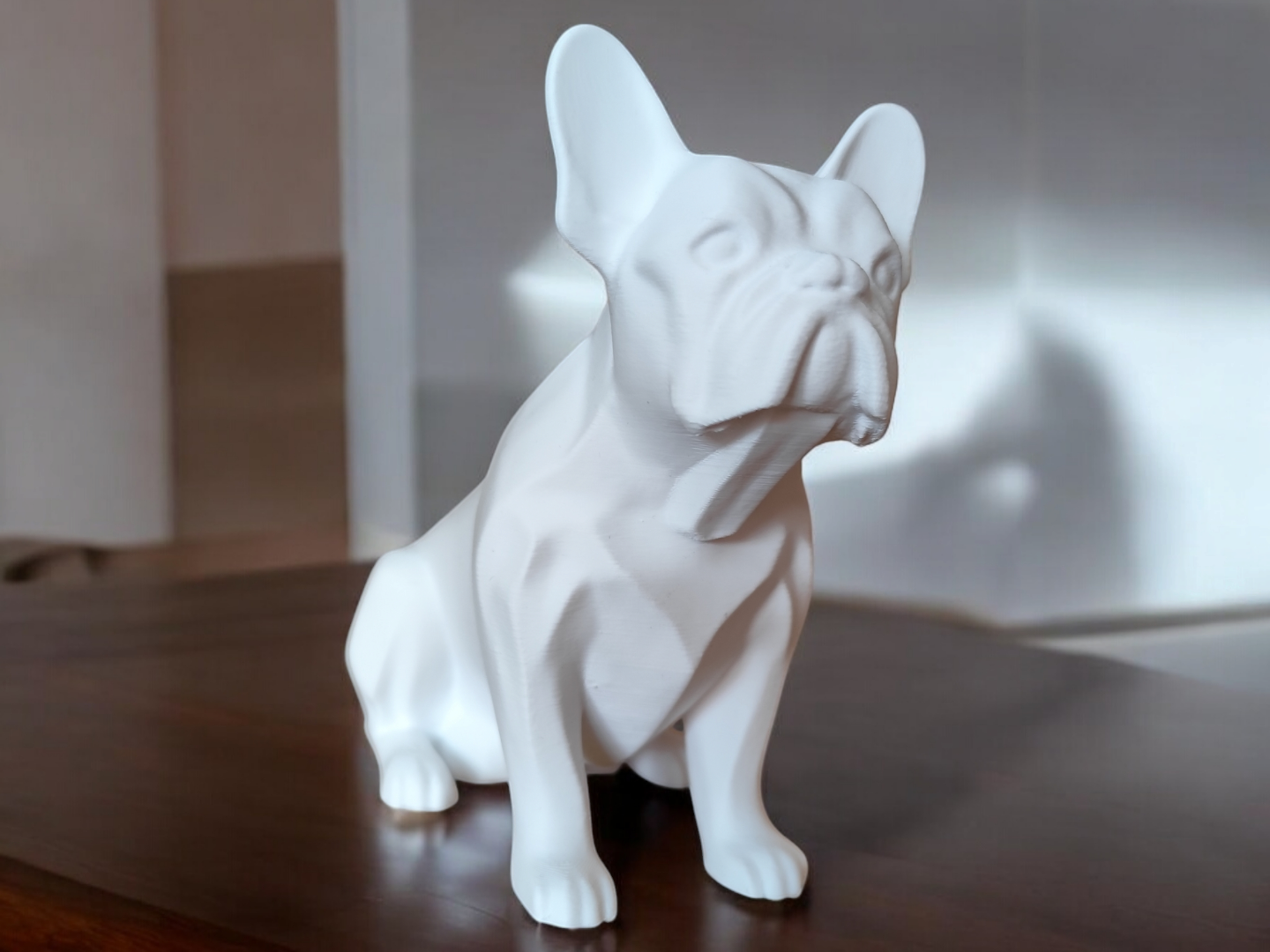 Minimalist french bulldog sculpture in profile, showing realistic proportions and clean lines