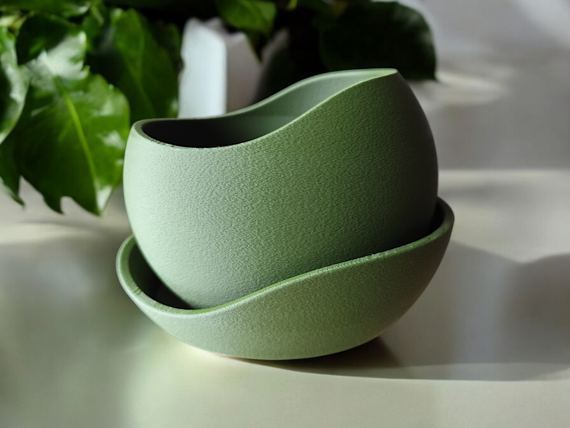 Detail of rippled texture on minimalist plant pot with drainage hole