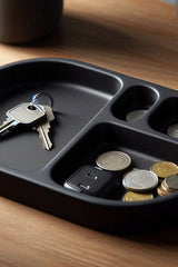 Rounded key tray in neutral matte finish, top view showing shallow bowl shape