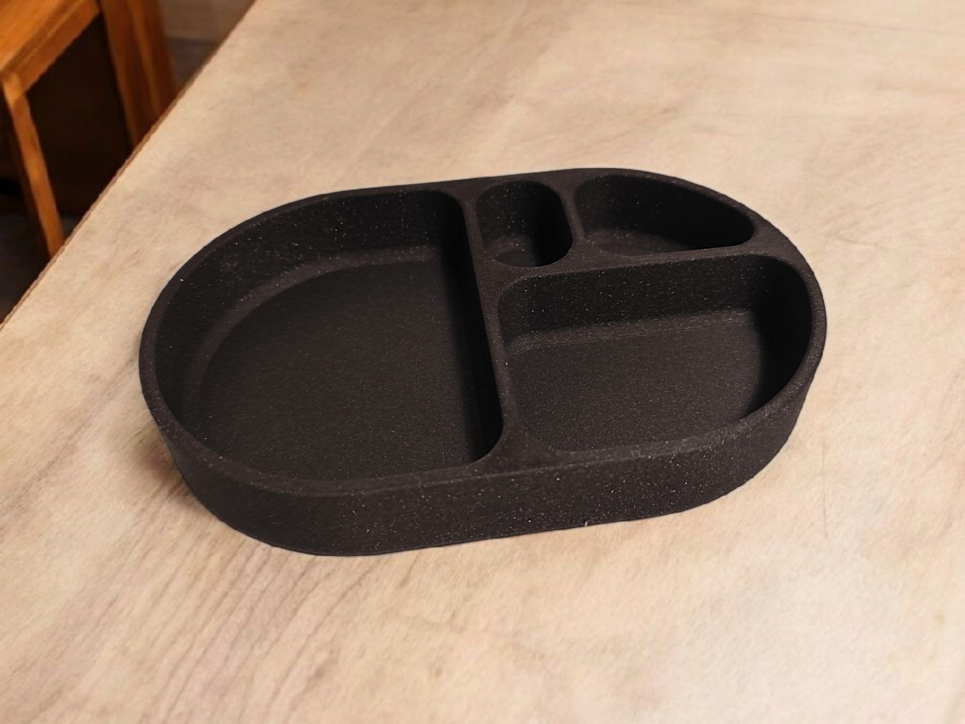 Minimalist rounded key tray on white entryway shelf with keys and coins