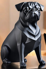 Close-up of minimalist pug sculpture showing smooth matte black surface