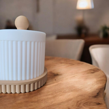 Textured ribbed surface detail of the ceramic-look organizer jar