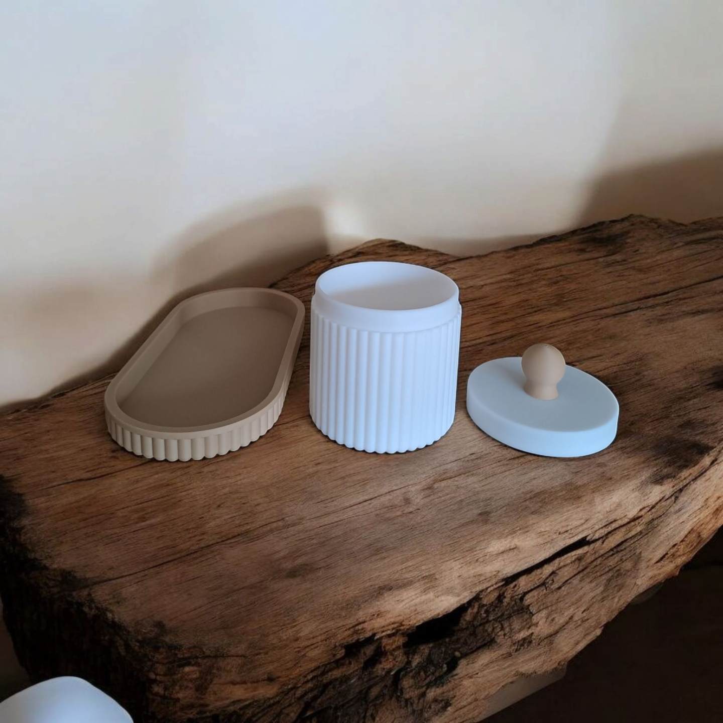 Close-up of ribbed jewelry organizer jar with lid and matching tray in pink and white
