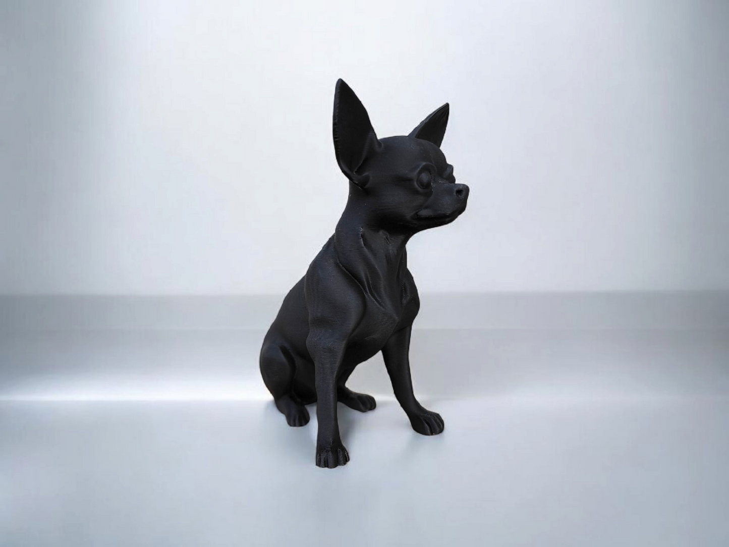 Close-up of minimalist chihuahua sculpture showing clean profile and alert posture