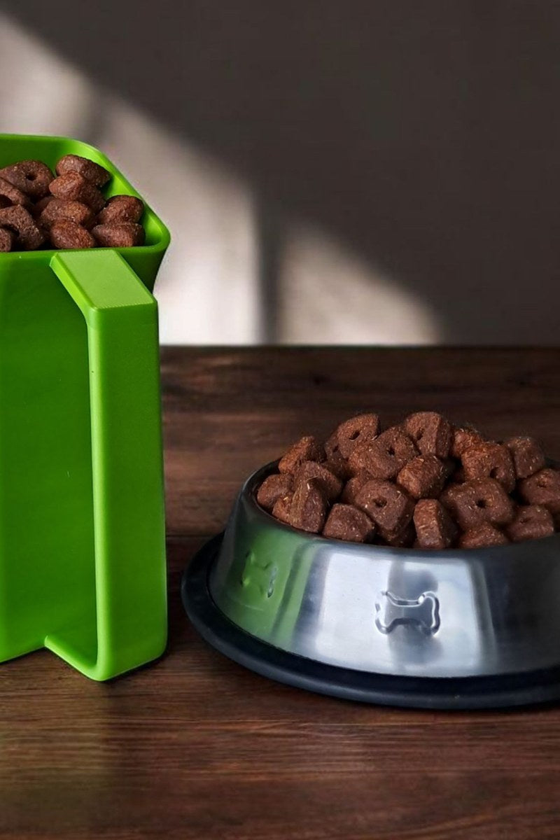 Modern curved pet food scoop with rounded bowl and handle detail
