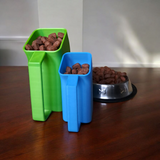 Pet food scoop resting beside a storage container in a minimalist kitchen