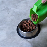 Modern curved pet food scoop with rounded bowl and handle detail
