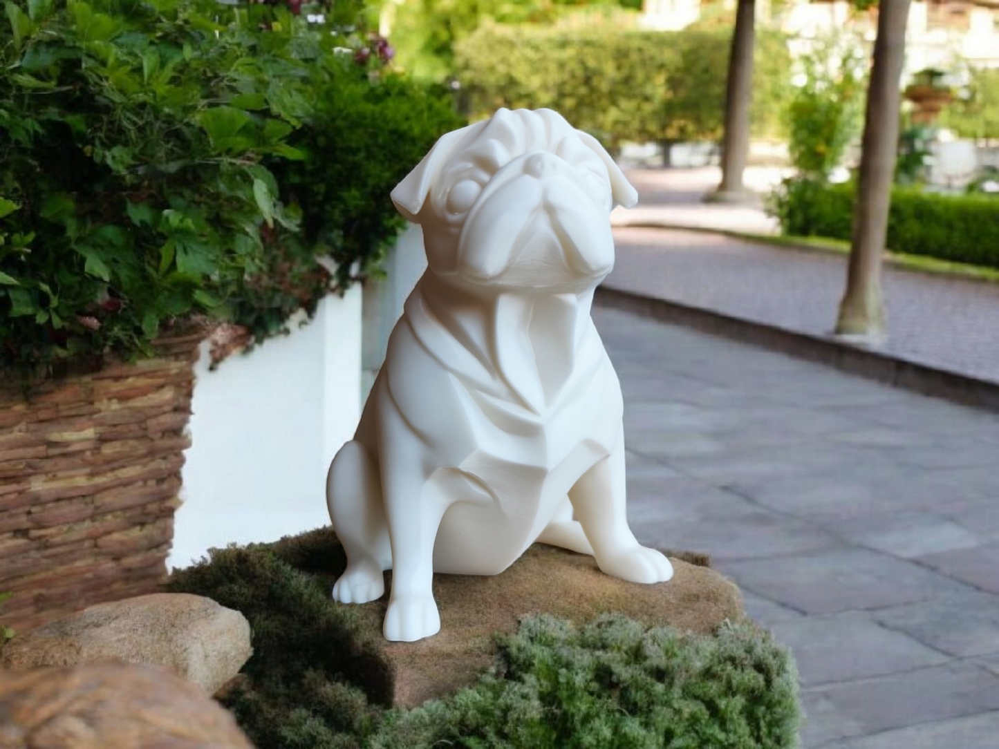 Minimalist pug sculpture displayed on a shelf among books and neutral décor