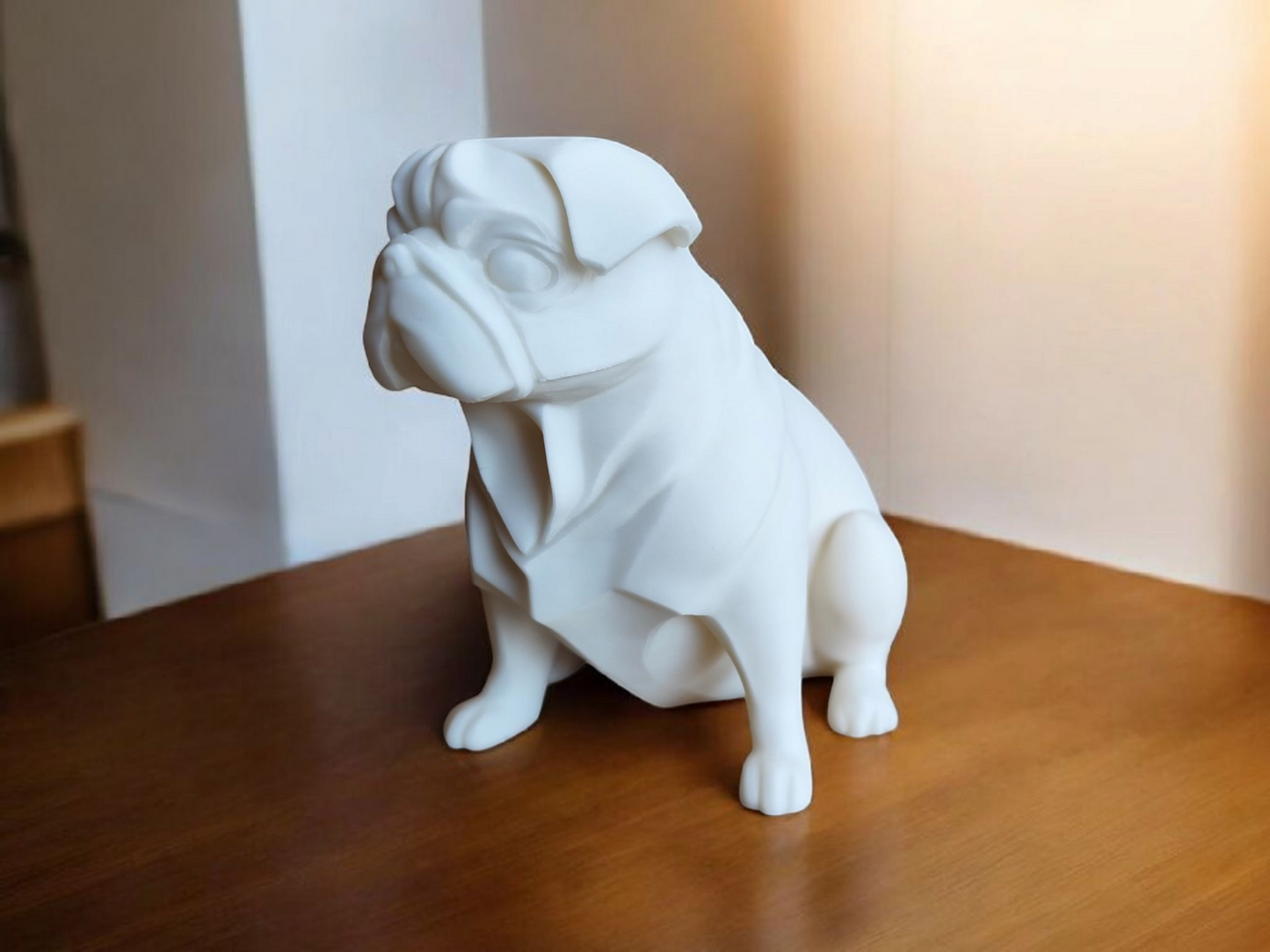 Side profile detail of the pug sculpture, showing its characteristic proportions and finish