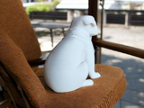 Close-up of minimalist pug sculpture showing soft, rounded forms and smooth surface