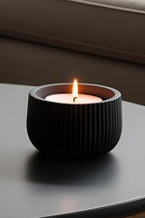 Close-up of ribbed tealight holder showing vertical texture detail