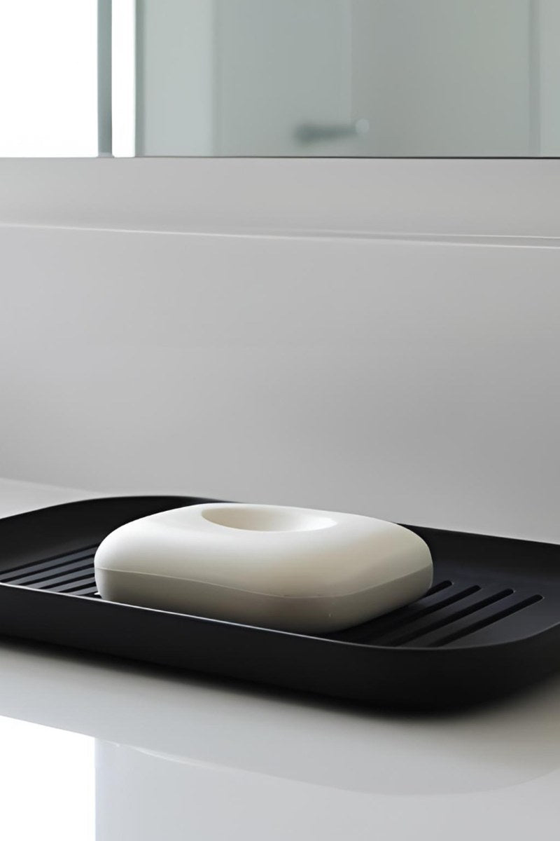 Minimalist soap dish with grooved surface detail in soft white