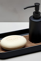 Top-down view of minimalist modern soap dish with integrated drip tray