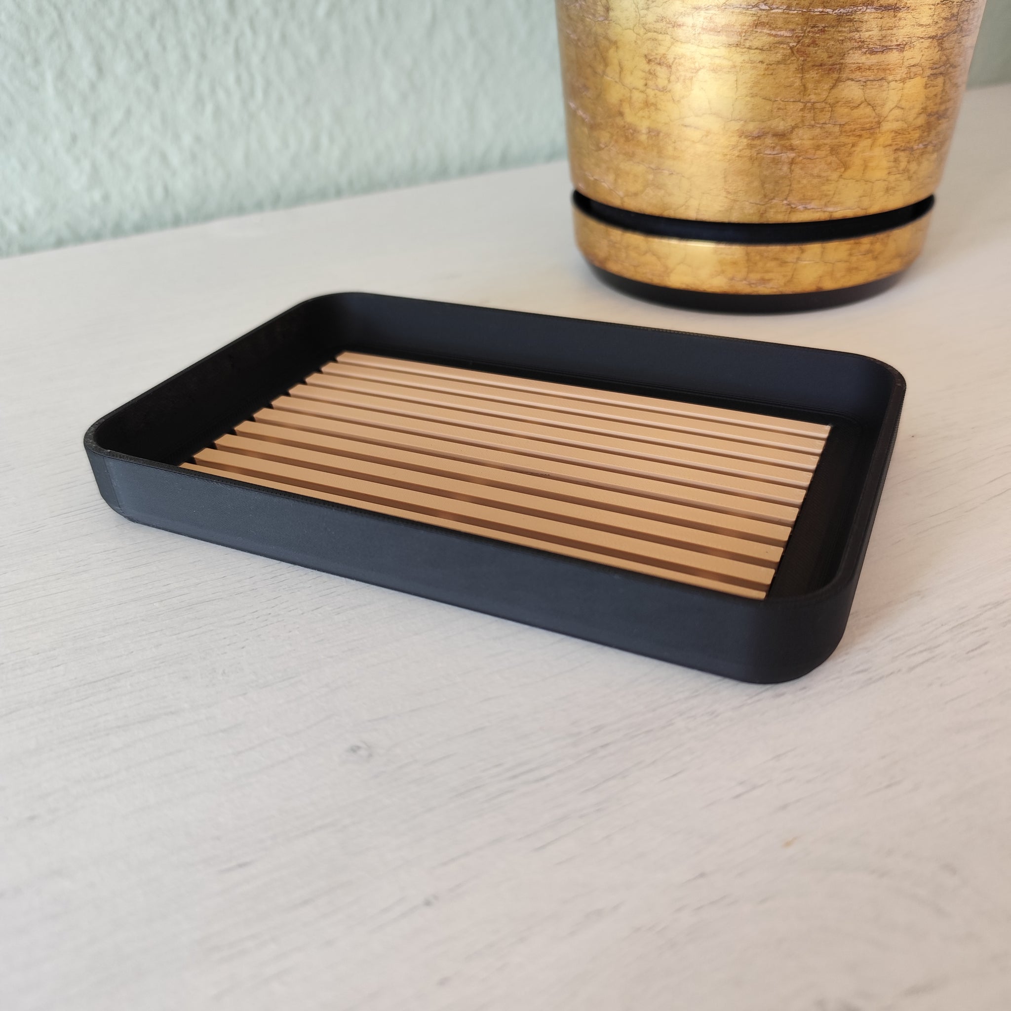 Modern soap dish styled in neutral bathroom setting with bar soap