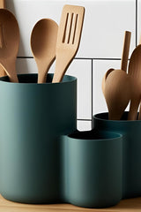 Modern kitchen utensil holder with three cups, close-up view